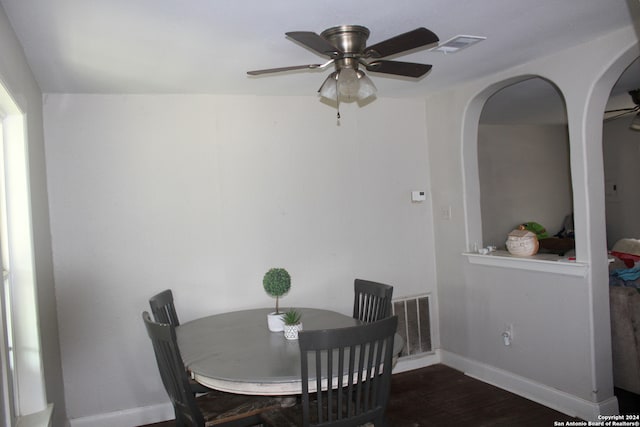 dining space with ceiling fan and dark hardwood / wood-style floors