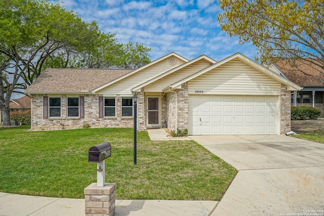 single story home featuring a garage and a front yard