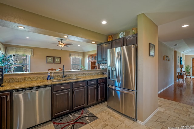 kitchen with ceiling fan, light tile patterned floors, sink, and stainless steel appliances