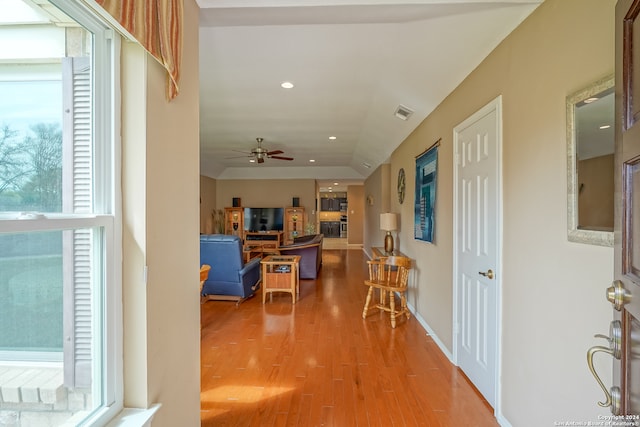 hall with hardwood / wood-style flooring and a wealth of natural light