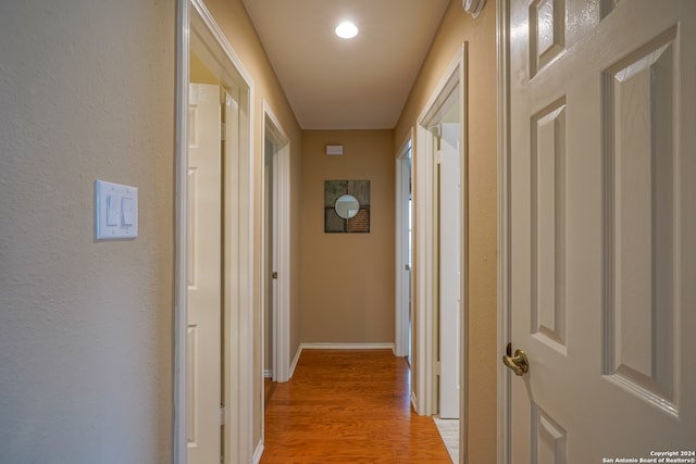 hallway featuring hardwood / wood-style floors