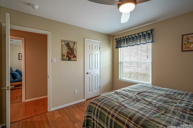 bedroom featuring hardwood / wood-style floors and ceiling fan