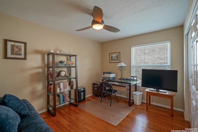 office area featuring hardwood / wood-style floors, a textured ceiling, and ceiling fan