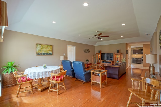 dining area with ceiling fan and wood-type flooring