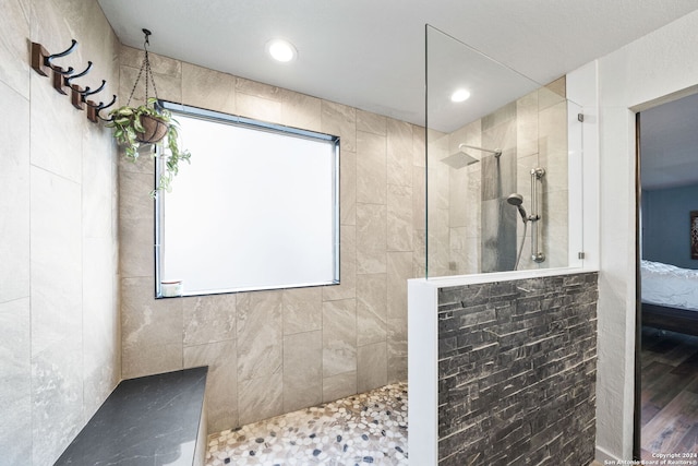 bathroom with a tile shower