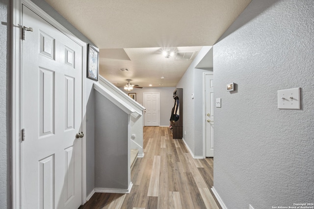 hall with light wood-type flooring