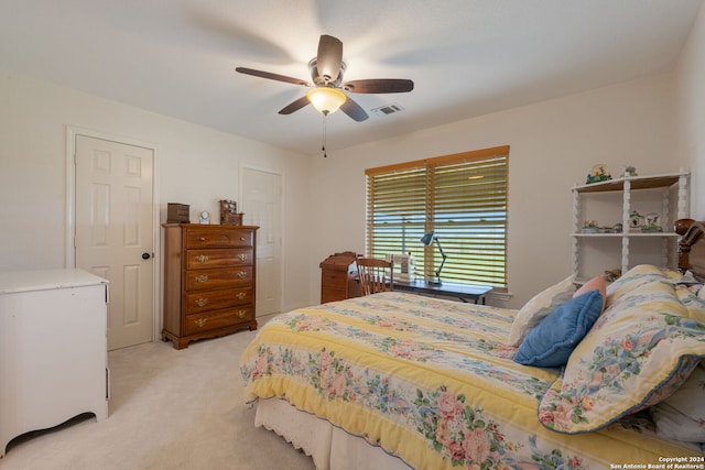 carpeted bedroom with ceiling fan