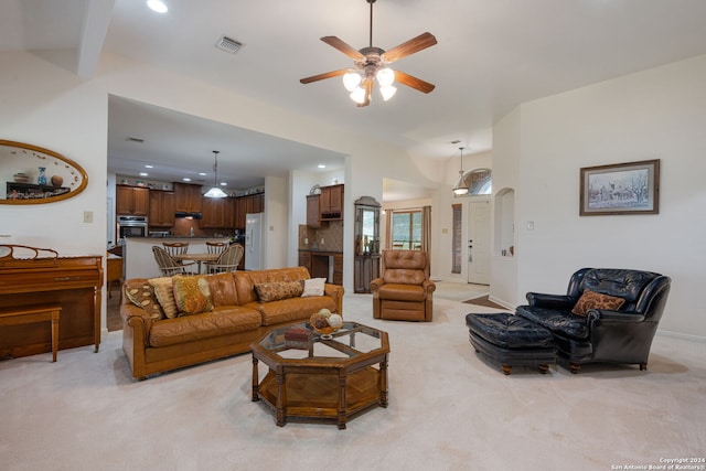 living room with light carpet and ceiling fan