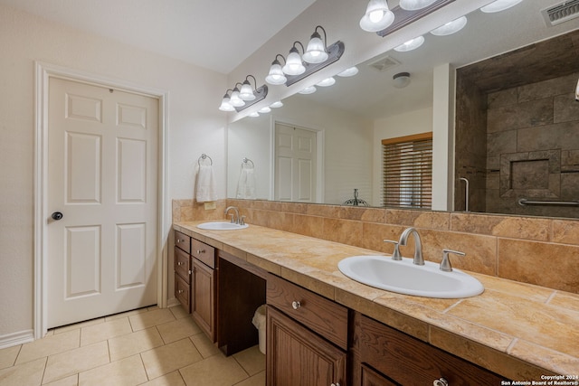 bathroom featuring tile patterned flooring and vanity