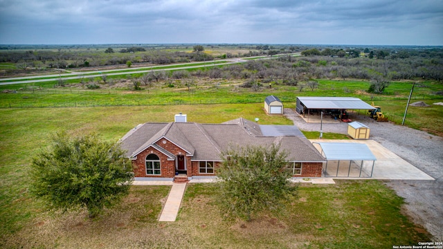 birds eye view of property featuring a rural view