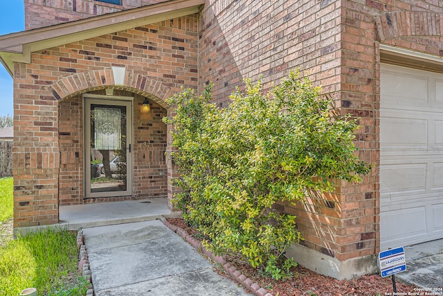 entrance to property featuring a garage