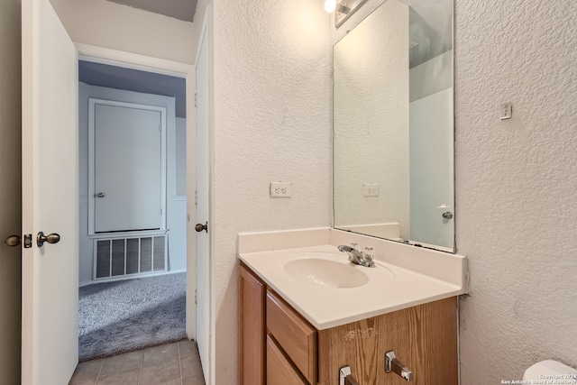 bathroom featuring vanity and tile floors