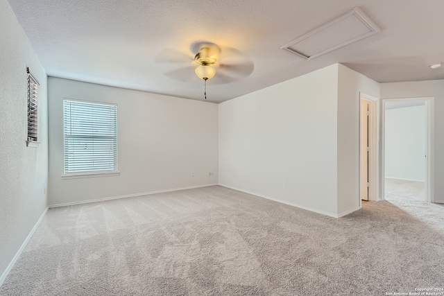 empty room featuring light carpet and ceiling fan