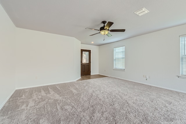 carpeted empty room with ceiling fan