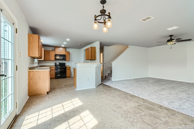 kitchen featuring a healthy amount of sunlight, light colored carpet, ceiling fan with notable chandelier, and black appliances