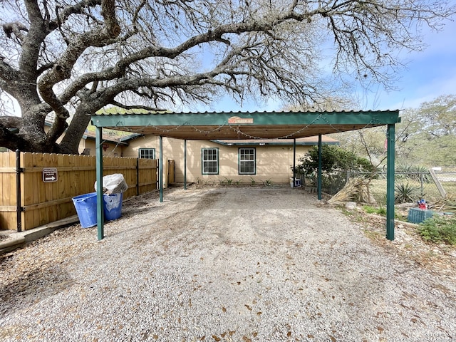 exterior space with a carport