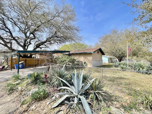 view of property exterior with a carport