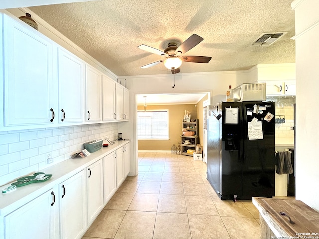 kitchen featuring ceiling fan, white cabinetry, backsplash, and black fridge with ice dispenser