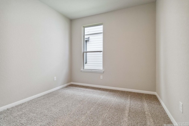 unfurnished room with carpet floors