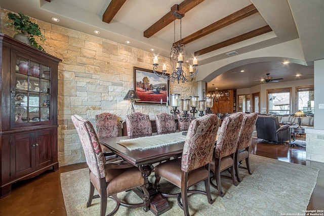 dining space featuring beam ceiling and ceiling fan with notable chandelier