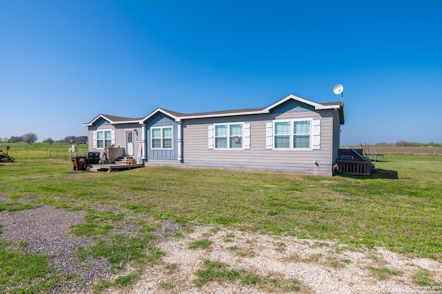 view of front of property with a front lawn