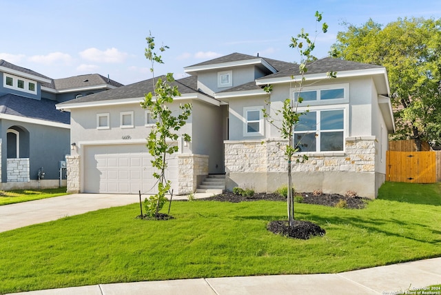 view of front of home with a front lawn and a garage