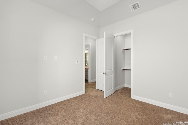 unfurnished bedroom featuring light colored carpet