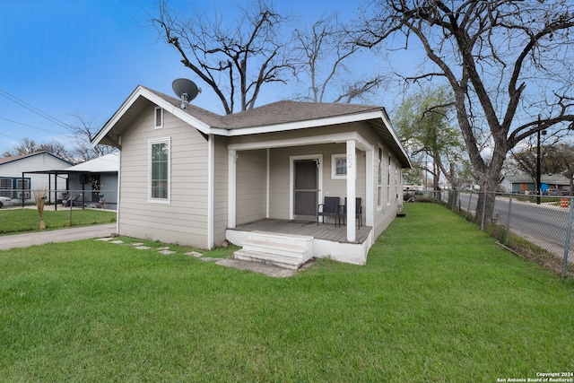 bungalow-style home with a front lawn