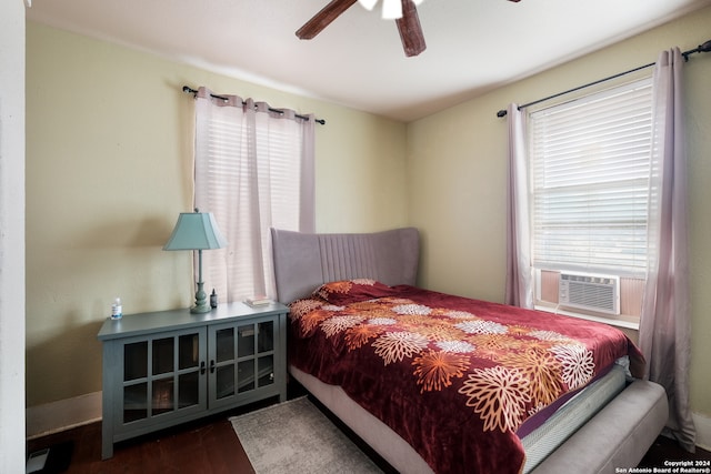 bedroom featuring ceiling fan and dark hardwood / wood-style flooring