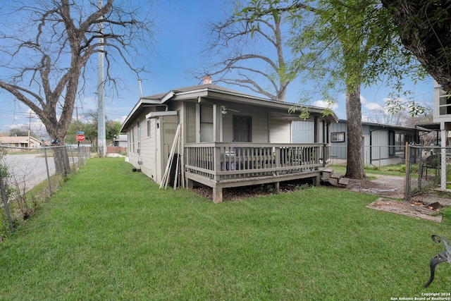 rear view of house with a yard