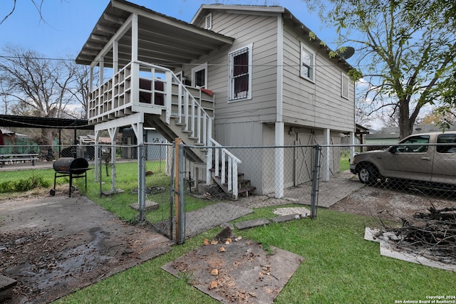 rear view of house with a lawn