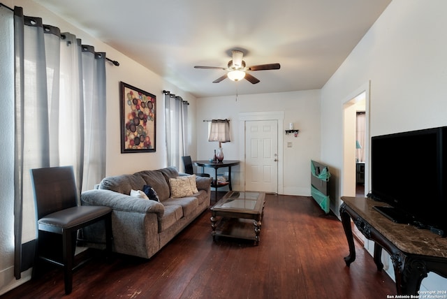 living room featuring dark hardwood / wood-style flooring, ceiling fan, and plenty of natural light