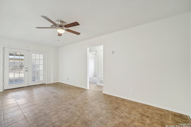 spare room featuring ceiling fan, light tile patterned floors, and french doors