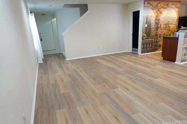 spare room with light hardwood / wood-style floors