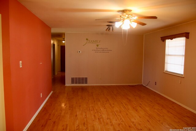 unfurnished room with light hardwood / wood-style floors and ceiling fan