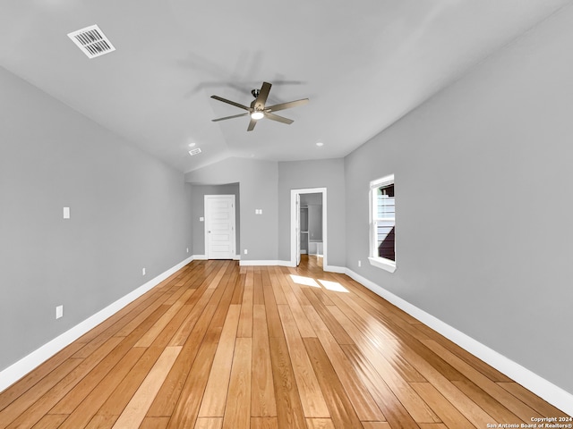 unfurnished room featuring light hardwood / wood-style flooring, vaulted ceiling, and ceiling fan