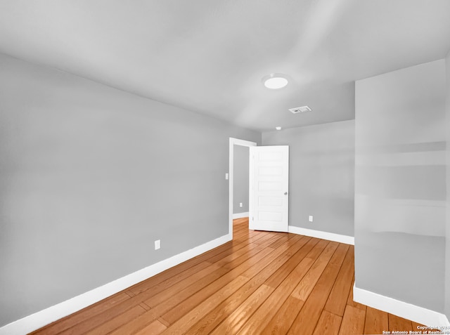 unfurnished room featuring light wood-type flooring