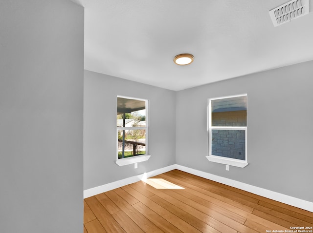 unfurnished room featuring light wood-type flooring