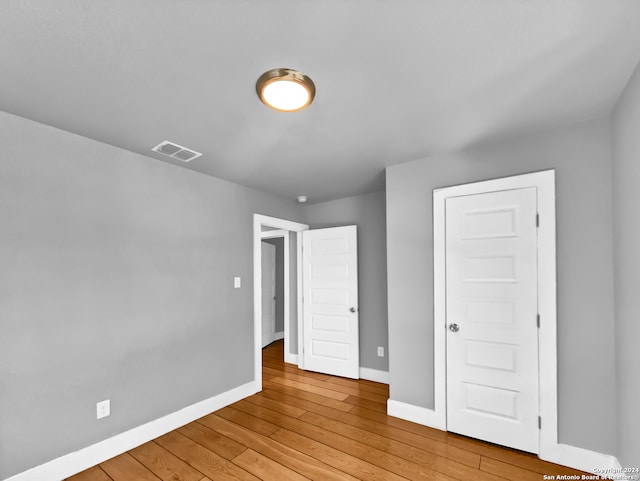 spare room with light wood-type flooring