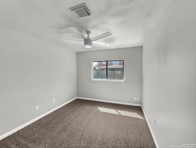 spare room with carpet and ceiling fan