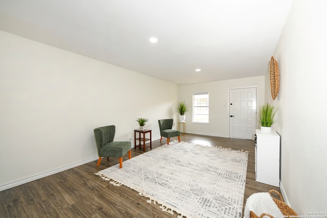 sitting room featuring dark hardwood / wood-style floors