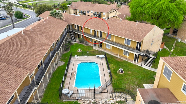 view of swimming pool featuring a lawn and a patio area