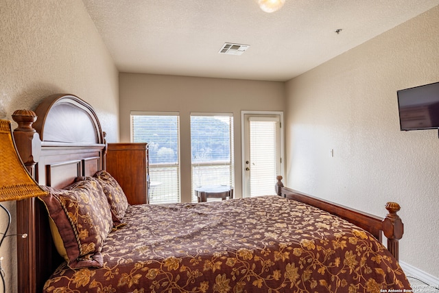 bedroom featuring a textured ceiling