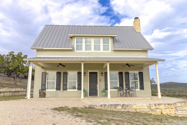 view of front facade with ceiling fan and covered porch