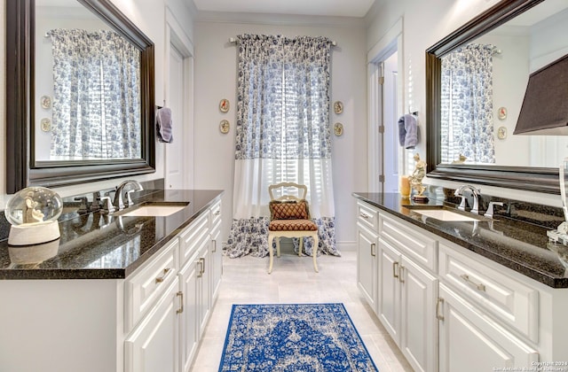 bathroom featuring ornamental molding, tile floors, and vanity