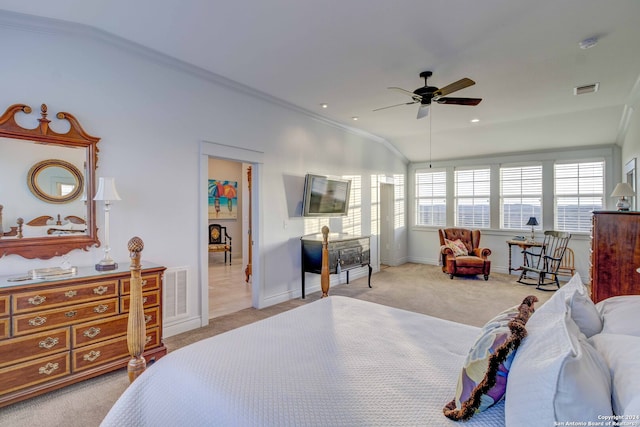 carpeted bedroom with lofted ceiling, crown molding, and ceiling fan