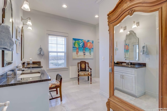 bathroom with dual bowl vanity, ornamental molding, and tile floors