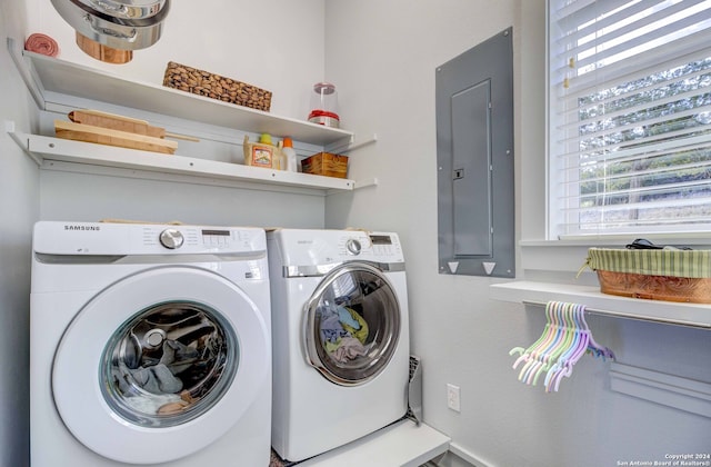 washroom with washer and dryer