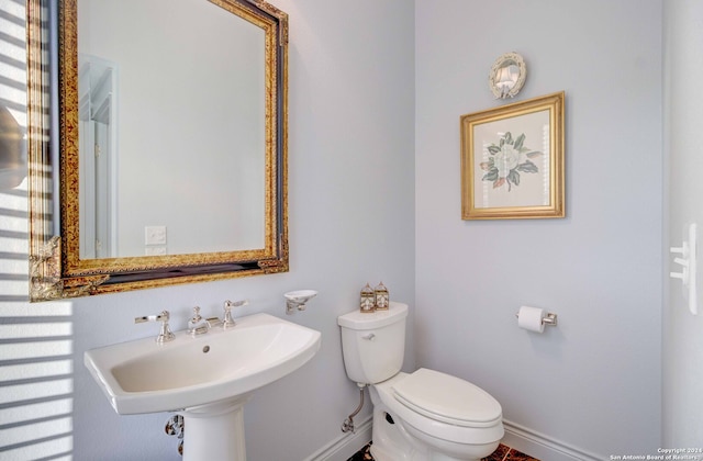 bathroom featuring sink and toilet