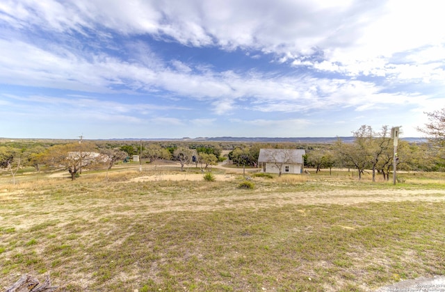 view of yard with a rural view